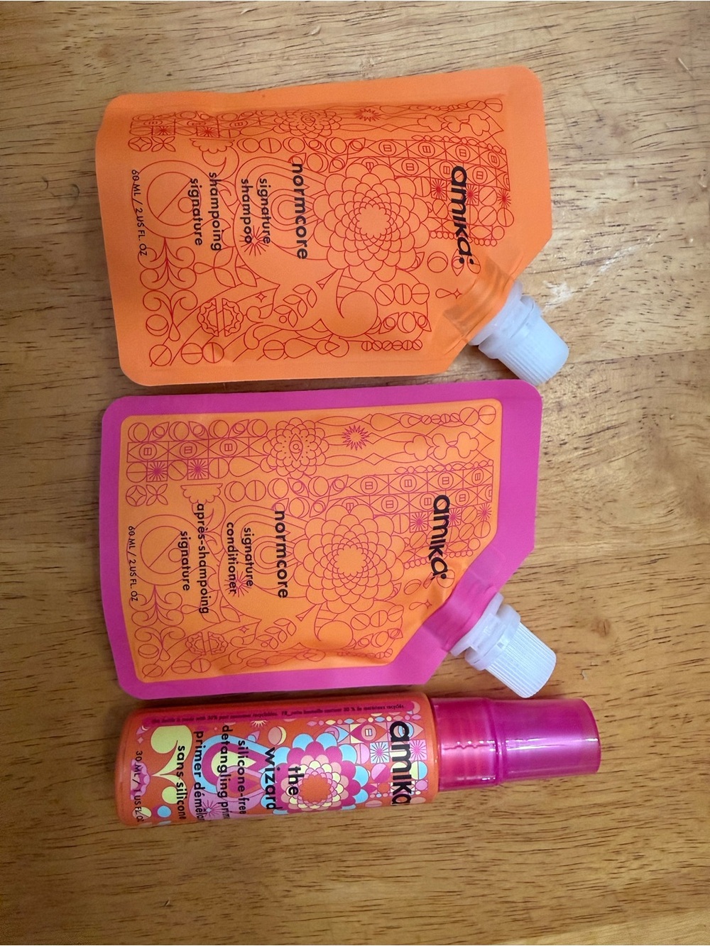 Amika travel size, norm, core shampoo, and conditioner, and the wizard